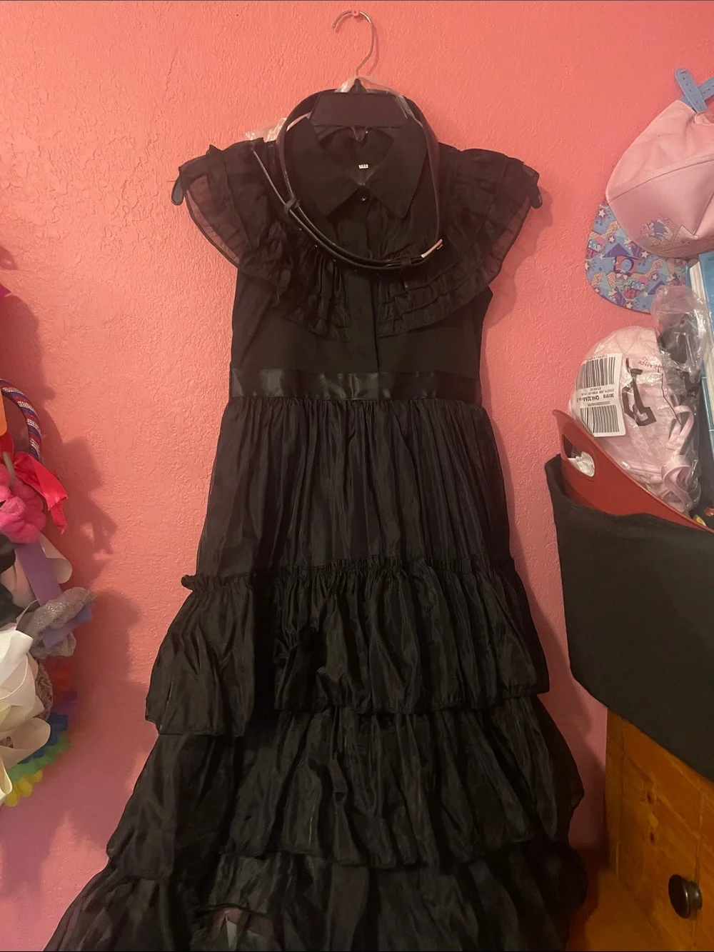 Wednesday black ruffle dress with gloves, choker necklace, and waist belt
